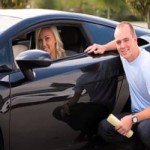 Blonde Woman buying a black car